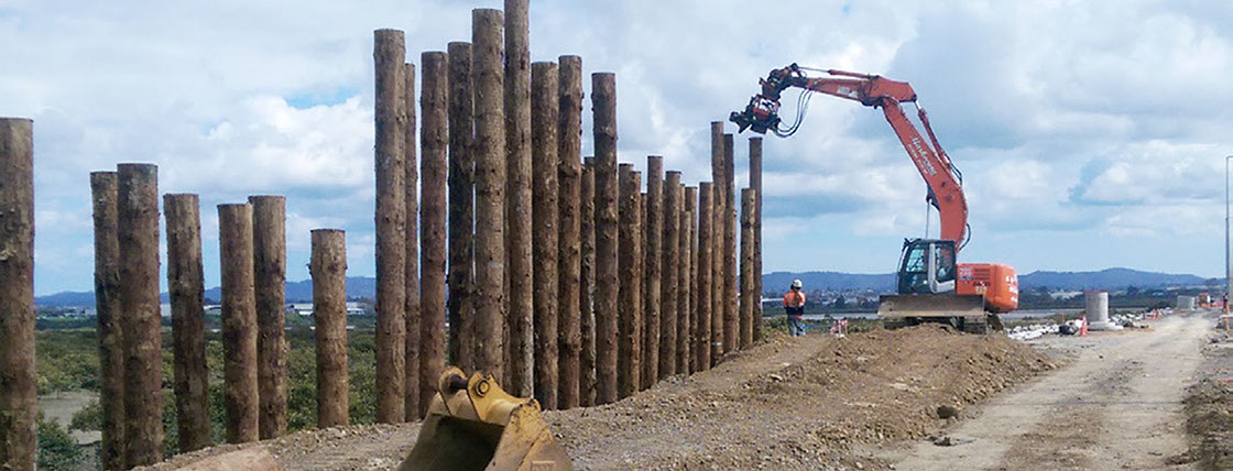 TTT MultiPole Uglie poles being installed by high frequency vibration for ground improvement of State Highway 16 Causeway Upgrade in Auckland.
